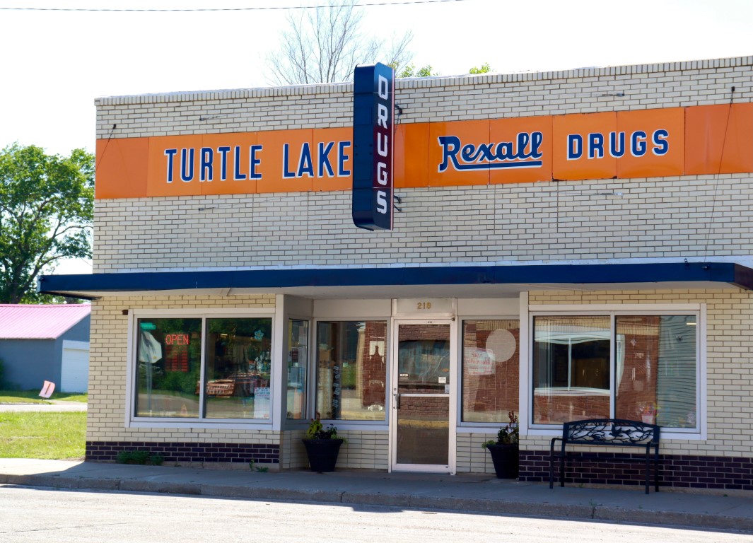 Turtle Lake Rexall Drug logo
